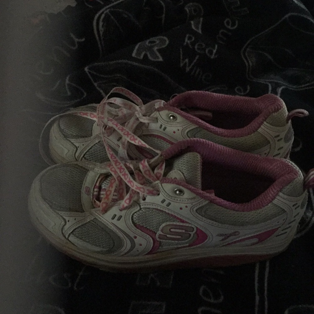 Woman sketchers tennis shoes.